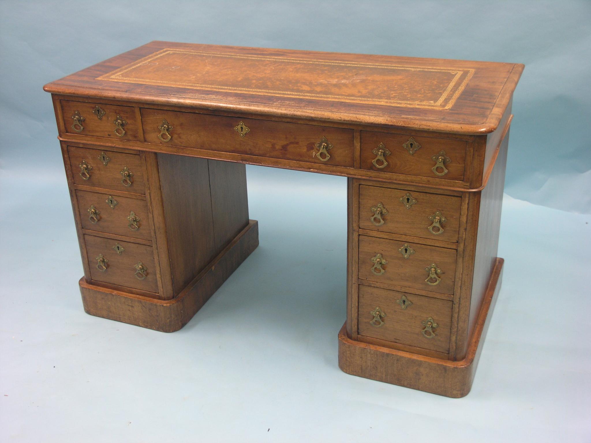 Appraisal: A Victorian mahogany desk inset gilt-tooled leather top above three