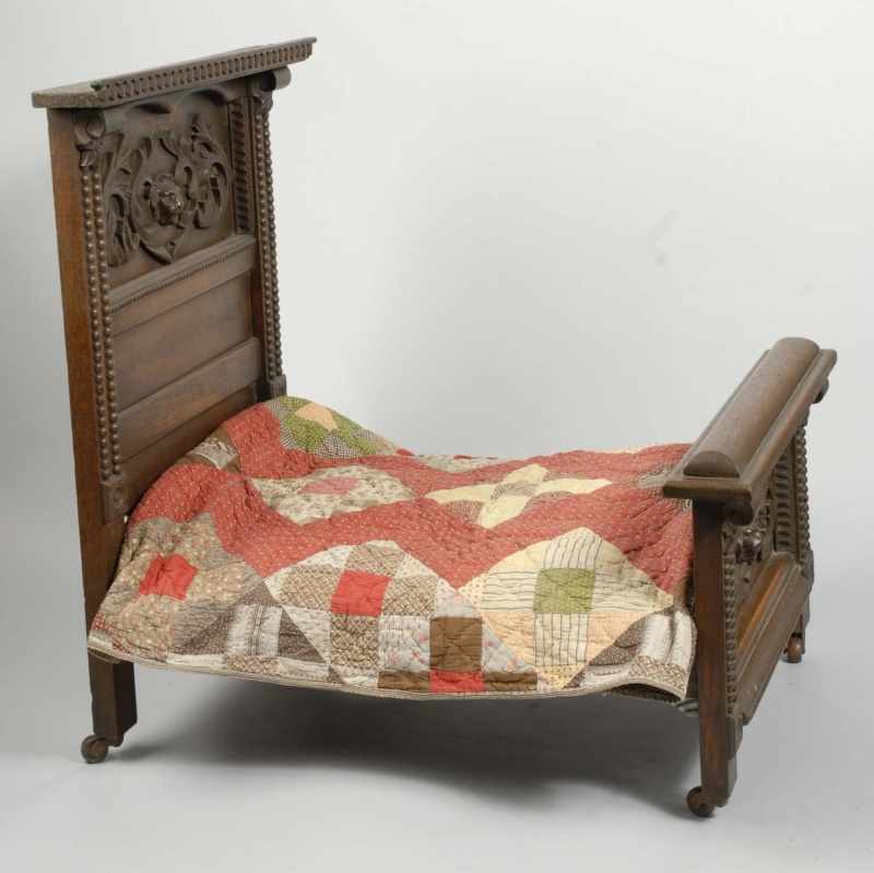 Appraisal: Large Victorian Period Carved Wood Doll Bed Description Carved lion