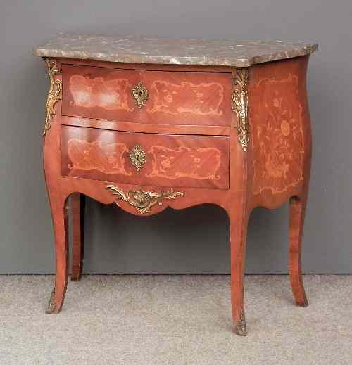 Appraisal: A French kingwood marquetry and gilt metal mounted serpentine fronted