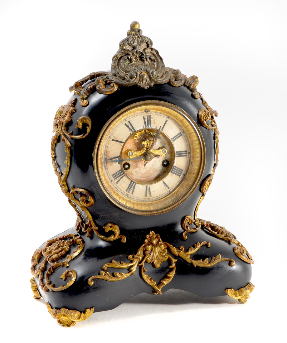 Appraisal: WATERBURY CAST IRON AND GILT METAL MANTLE CLOCK Shaped black