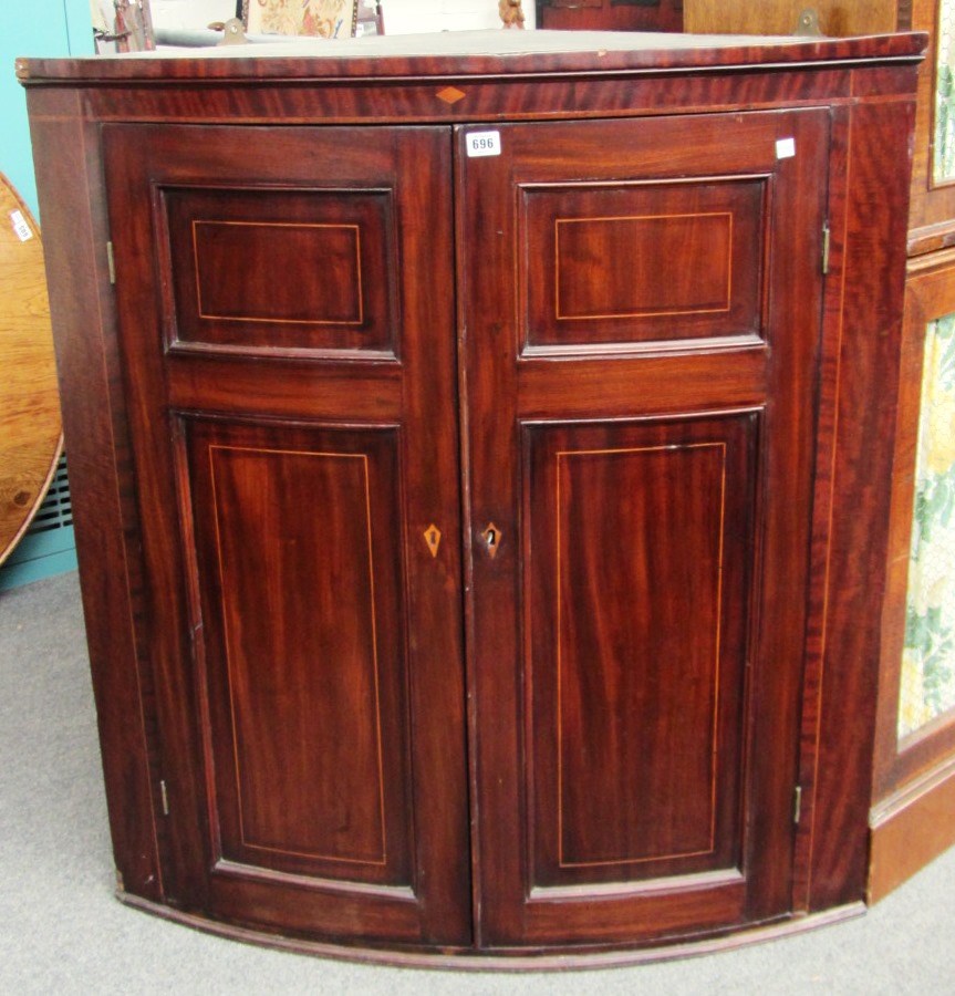 Appraisal: A George III inlaid mahogany hanging corner cupboard the pair