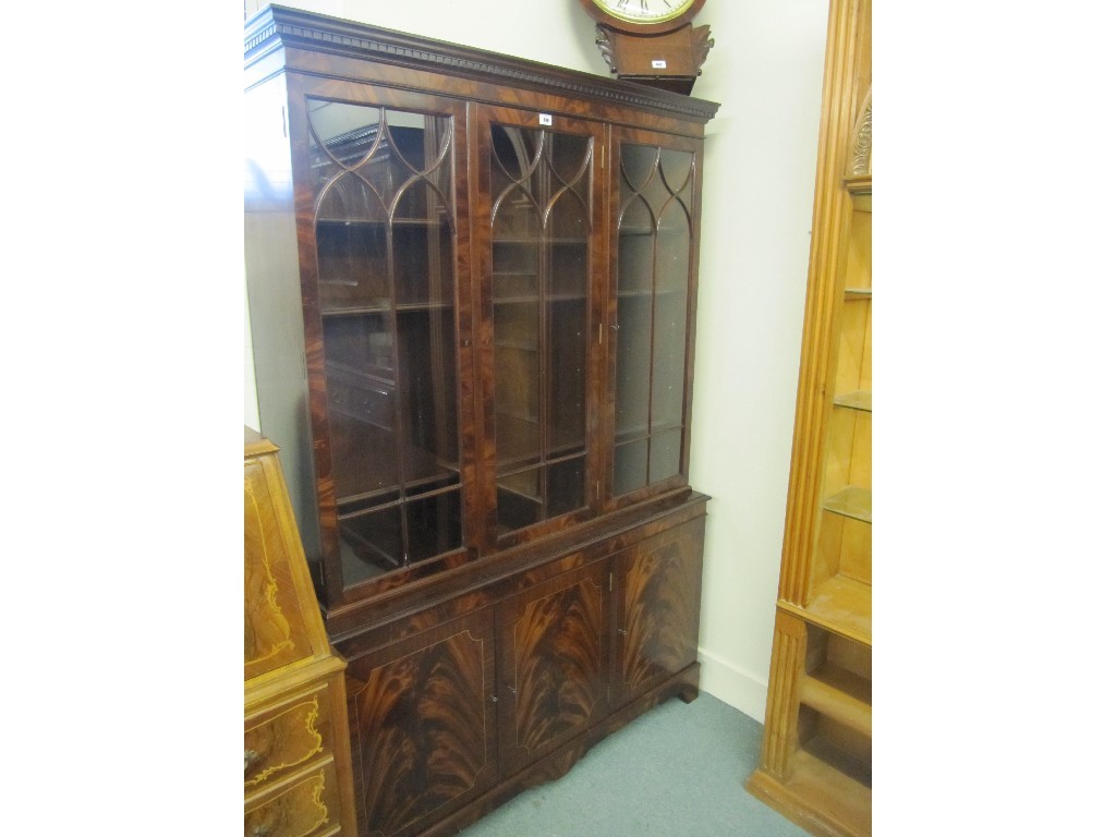 Appraisal: Reproduction mahogany bookcase on cupboard base