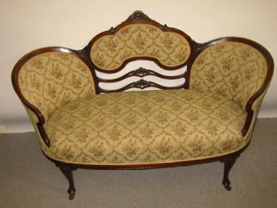 Appraisal: A VICTORIAN MAHOGANY FRAMED BOUDOIR SOFA of curved outline upholstered