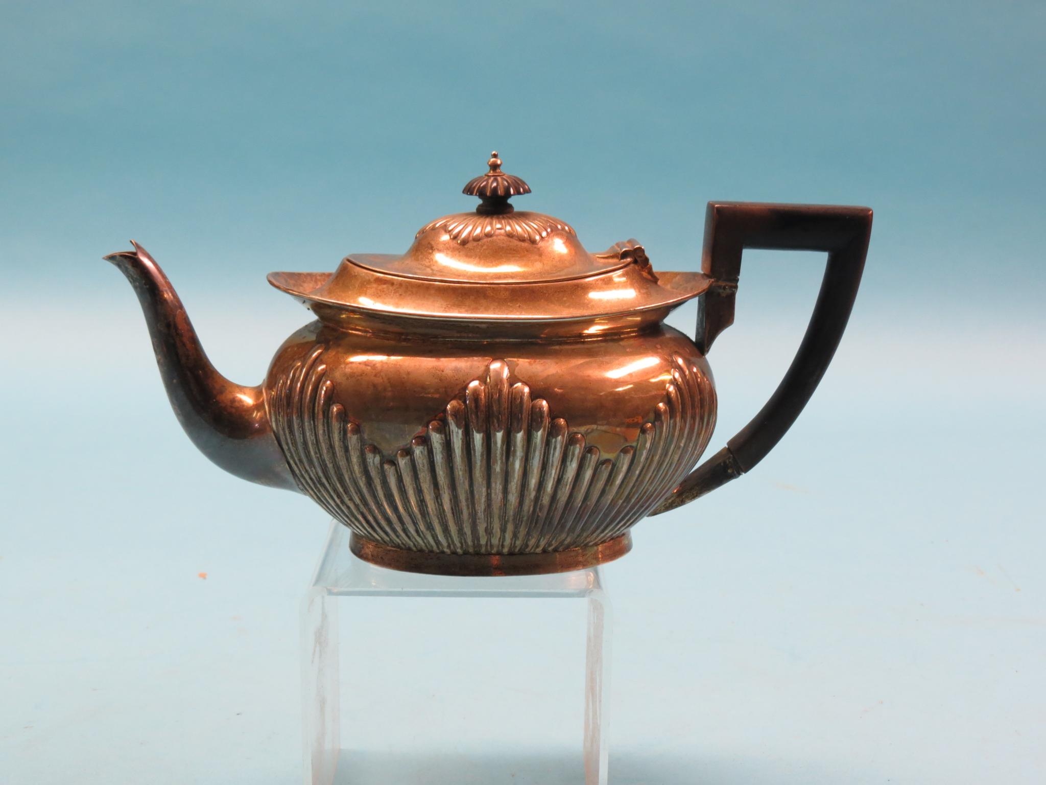 Appraisal: A Victorian oval silver teapot half-fluted diagonal design ebonised handle