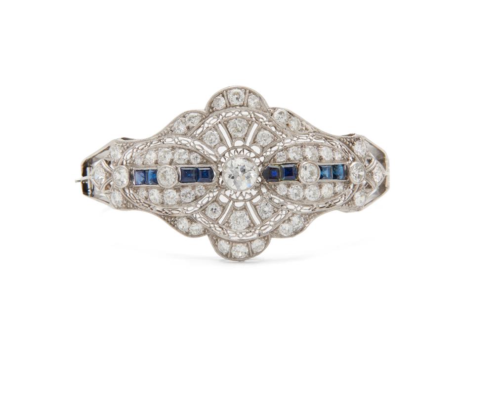 Appraisal: K Gold Diamond and Sapphire Bangle Bracelet the hinged bangle