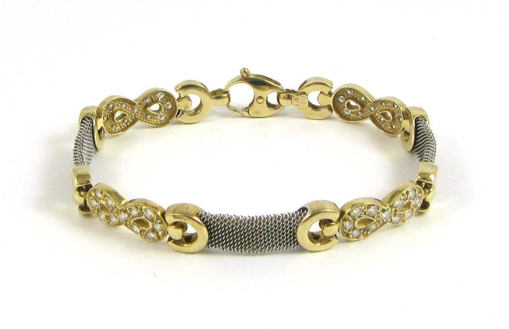 Appraisal: DIAMOND AND FOURTEEN KARAT TWO-TONE GOLD BRACELET The k yellow