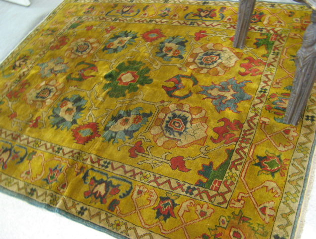 Appraisal: HAND KNOTTED TURKISH CARPET overall stylized floral decoration on gold