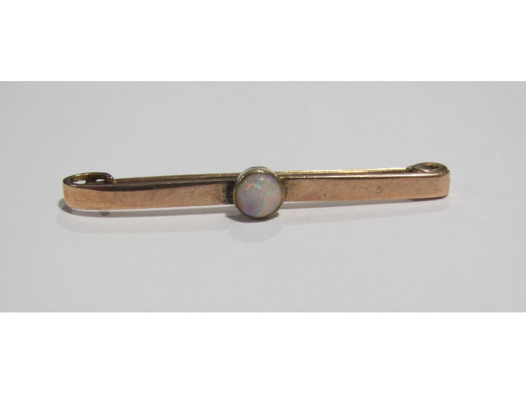 Appraisal: Nine carat rose gold bar brooch with central opal