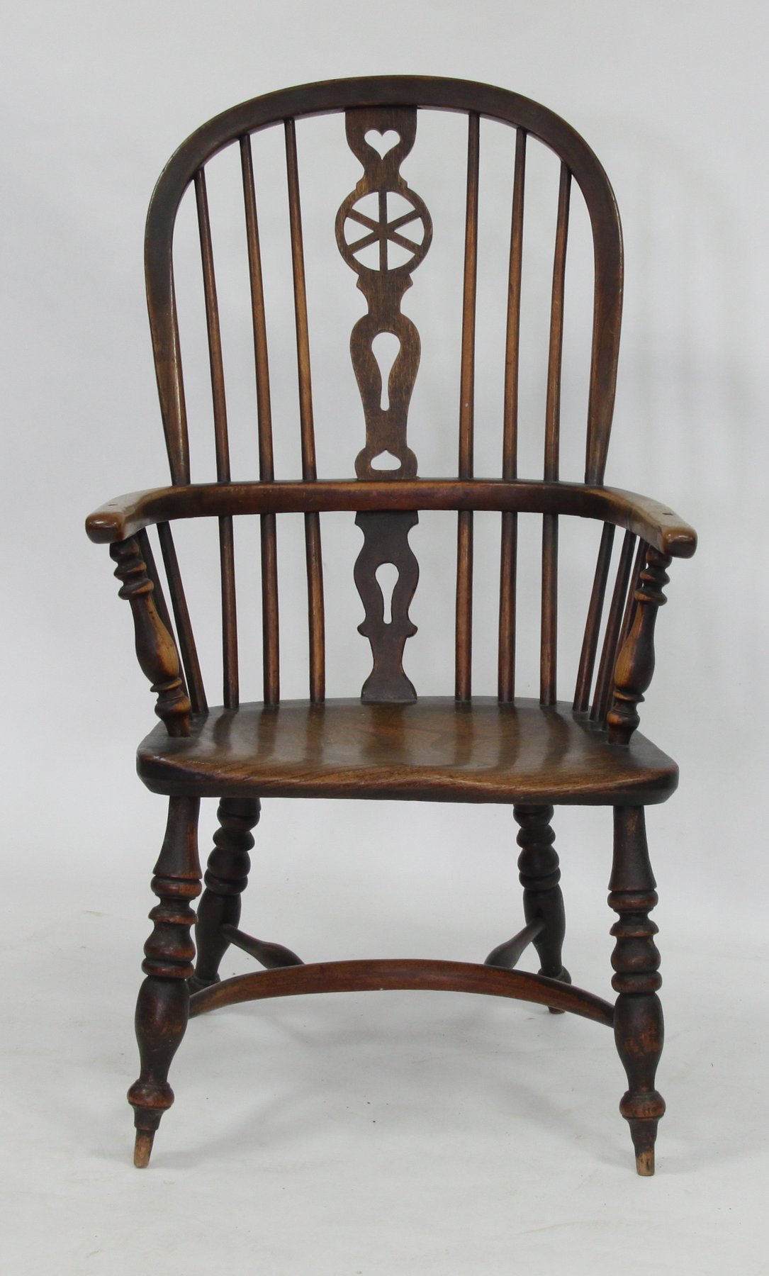 Appraisal: A th Century Windsor armchair with later wheel splat dished