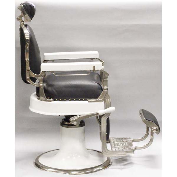 Appraisal: Koken white porcelain barbers' chair ca Black vinyl upholstery Nicely