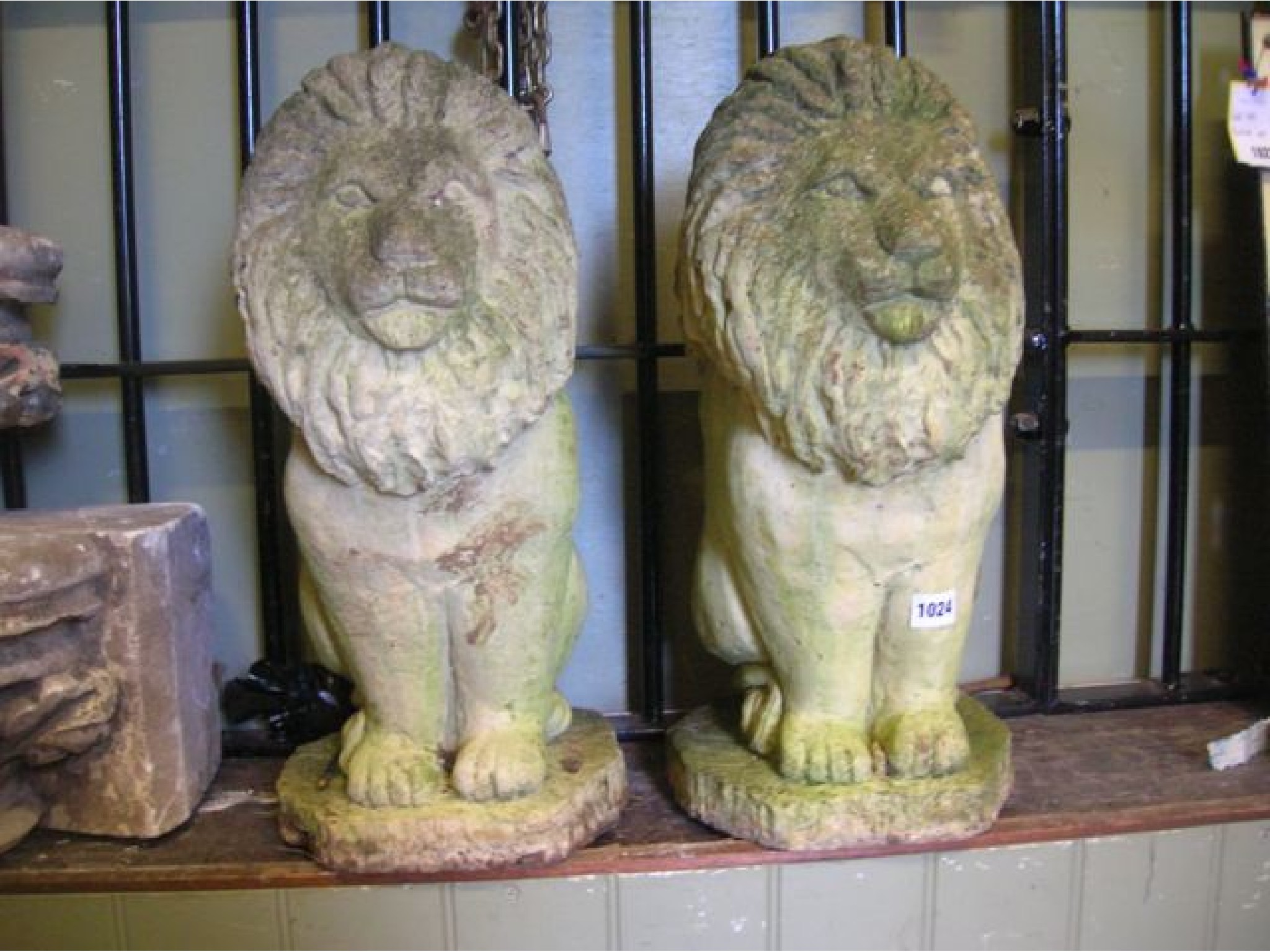 Appraisal: A pair of weathered cast composition stone garden ornaments in