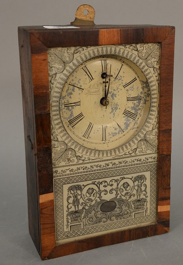 Appraisal: New England Clock Co mantle clock veneered wood lithographed glass