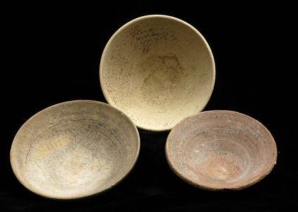 Appraisal: THREE ISLAMIC INCANTATION BOWLS Of simple shallow rounded cup form