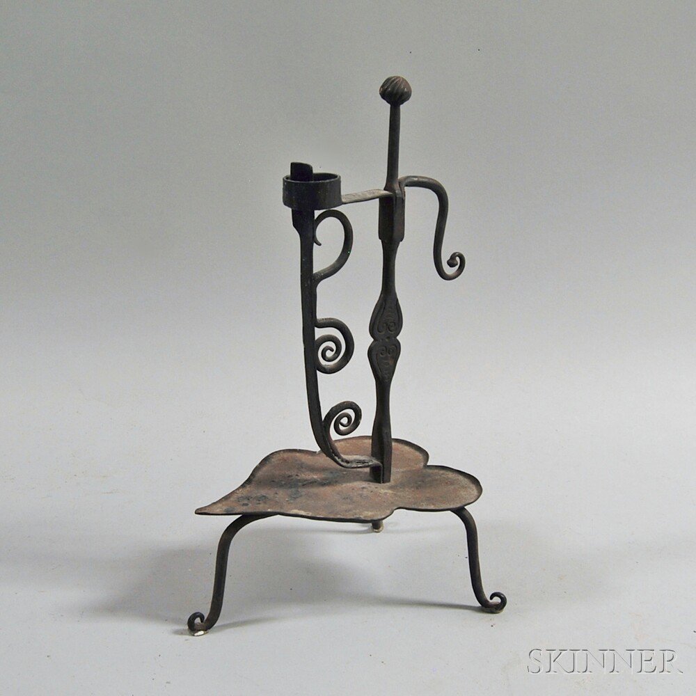 Appraisal: Wrought Iron Alpine Candleholder the incised ball finial on a