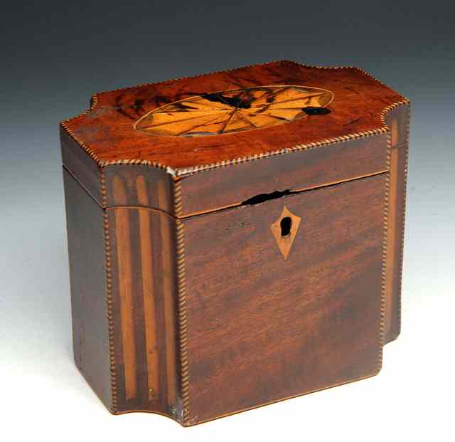 Appraisal: A GEORGIAN SMALL RECTANGULAR MAHOGANY TEA CADDY with inverted corners