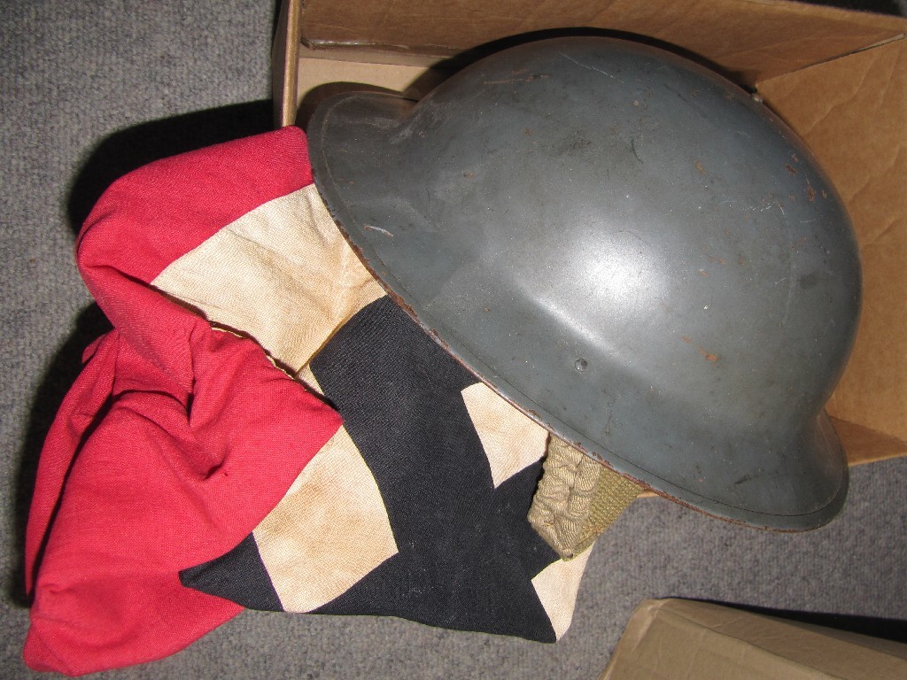 Appraisal: Lot comprising two flags and a tin helmet