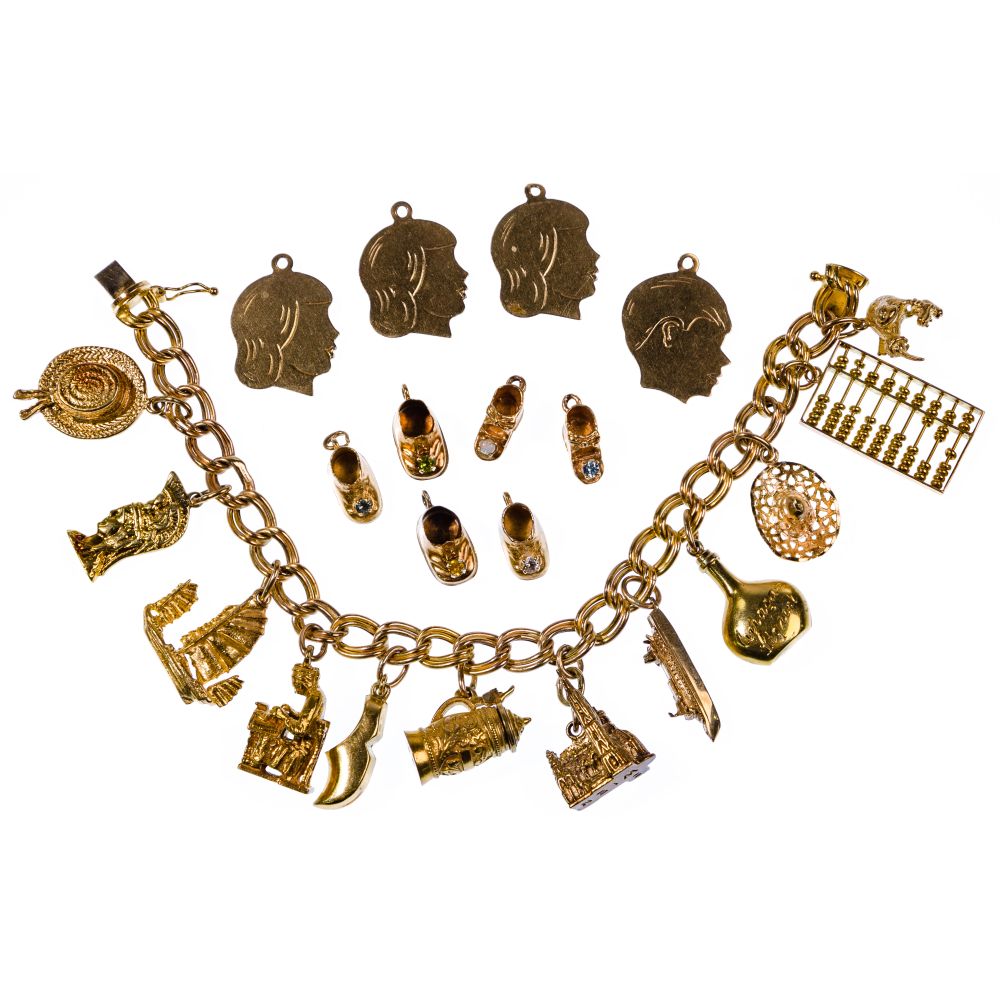 Appraisal: MIXED GOLD AND SILVER CHARM BRACELET AND CHARM ASSORTMENT items