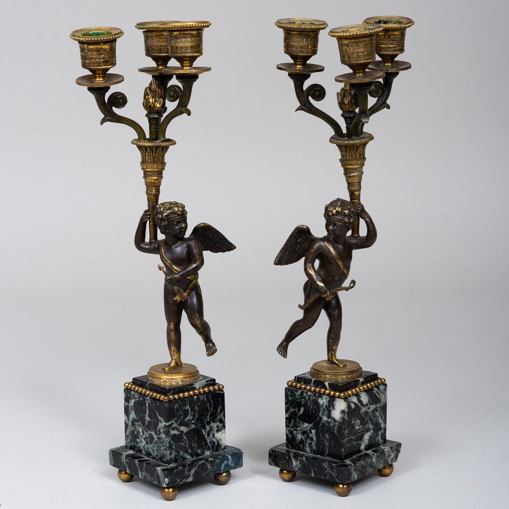 Appraisal: Pair of Patinated Gilt-Bronze and Verde Antico Marble Putto Form