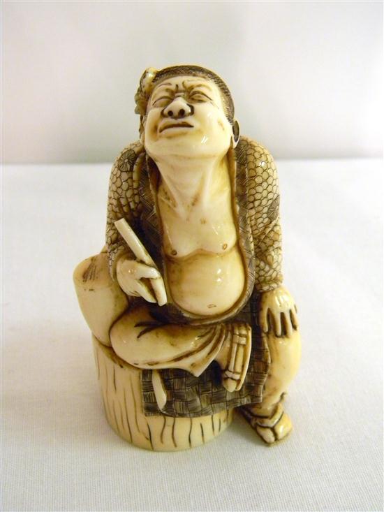 Appraisal: Japanese th C ivory figure of a man seated on