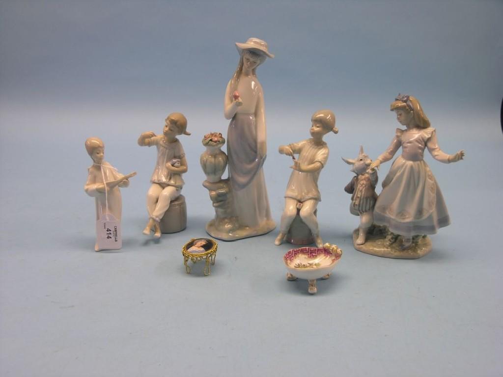 Appraisal: Three Lladro figures a Nao figure repaired Helena Wolfsohn shell-shaped