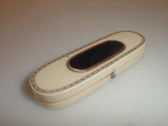 Appraisal: A thC ivory rectangular D-end case the hinged cover centred