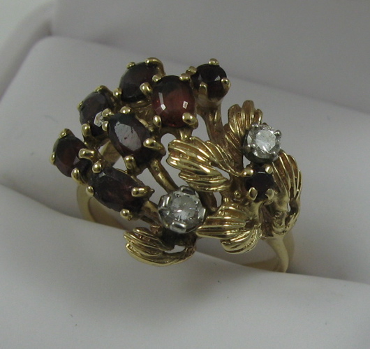 Appraisal: GARNET DIAMOND AND FOURTEEN KARAT GOLD RING set with eight