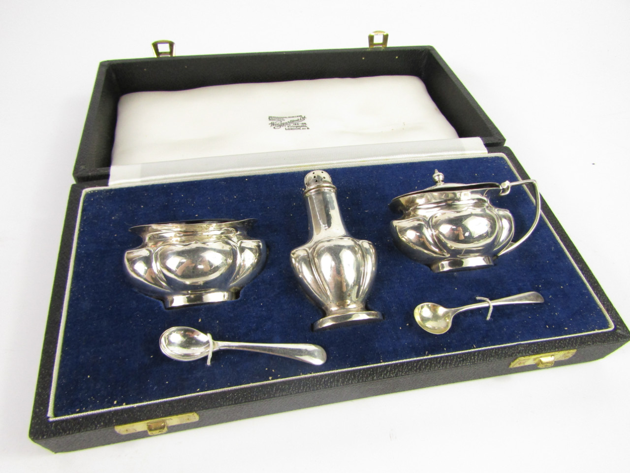 Appraisal: A silver semi fluted three piece condiment set with two