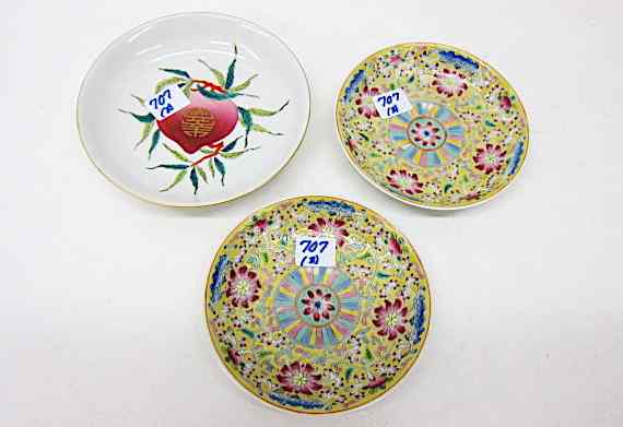 Appraisal: THREE CHINESE PORCELAIN LOW BOWLS a pair enameled with red