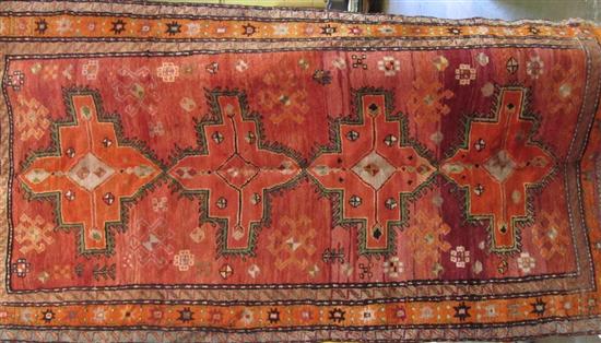 Appraisal: CARPET A tribal geometric area rug in orange pink and