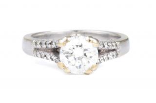 Appraisal: A Diamond Engagement Ring Solitaire diamond ring with two small