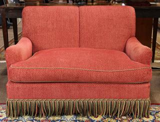 Appraisal: Modern upholstered loveseat having a sleigh back and pink upholstery