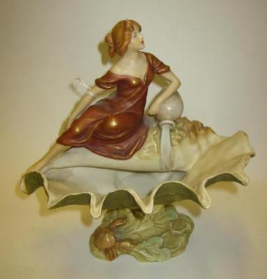 Appraisal: A ROYAL DUX ART NOUVEAU FIGURAL CENTRE PIECE modelled as