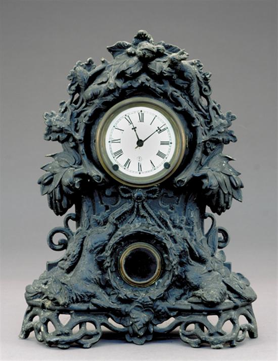 Appraisal: Two mantel clocks cast-metal hunting clock decorated with figures of