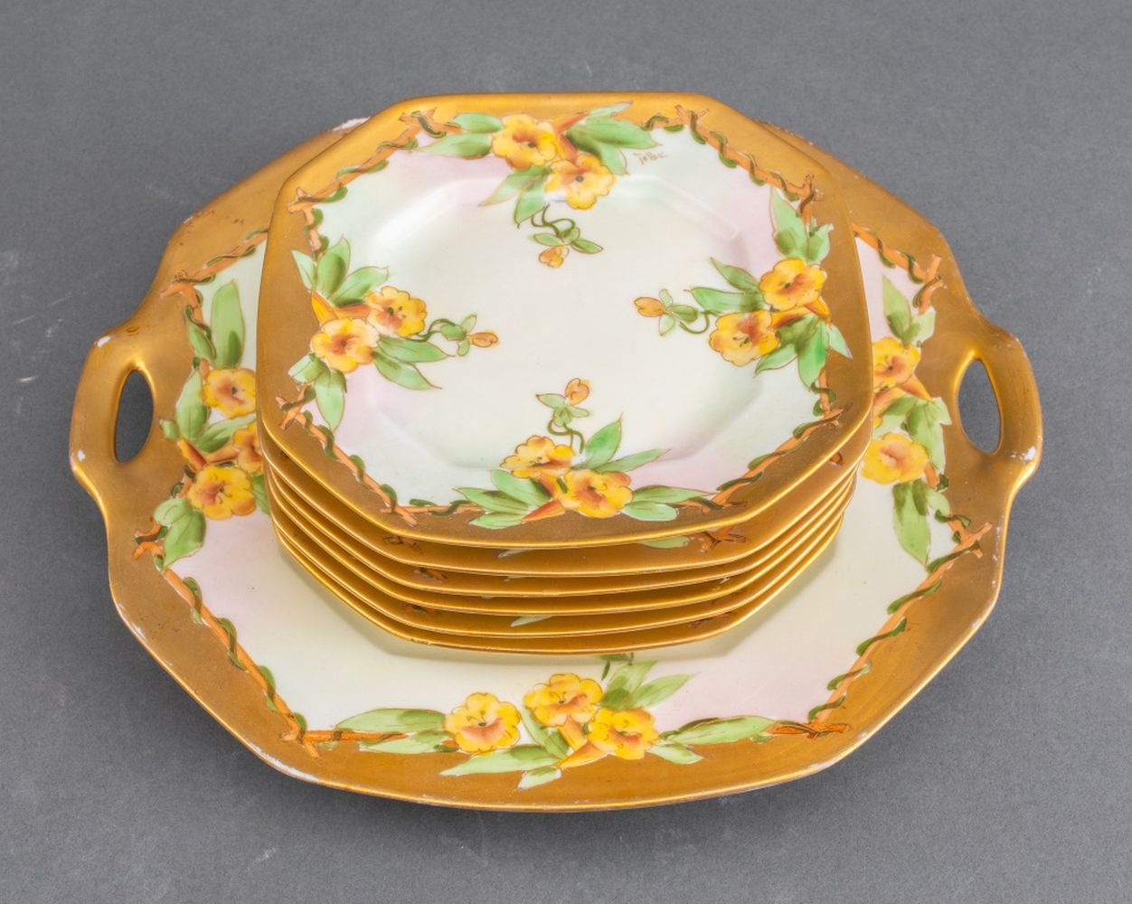 Appraisal: D CO LIMOGES TRUMPET VINE CAKE SERVICE R Delini res