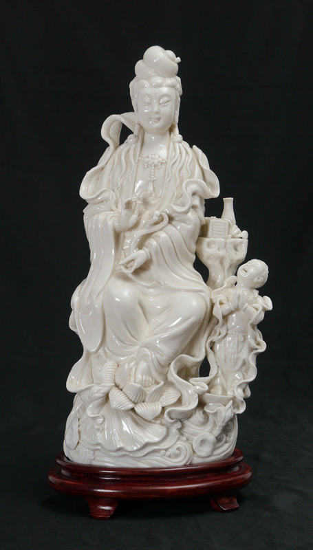 Appraisal: BLANC DE CHINE QUAN YIN FIGURE ON STAND Figure of