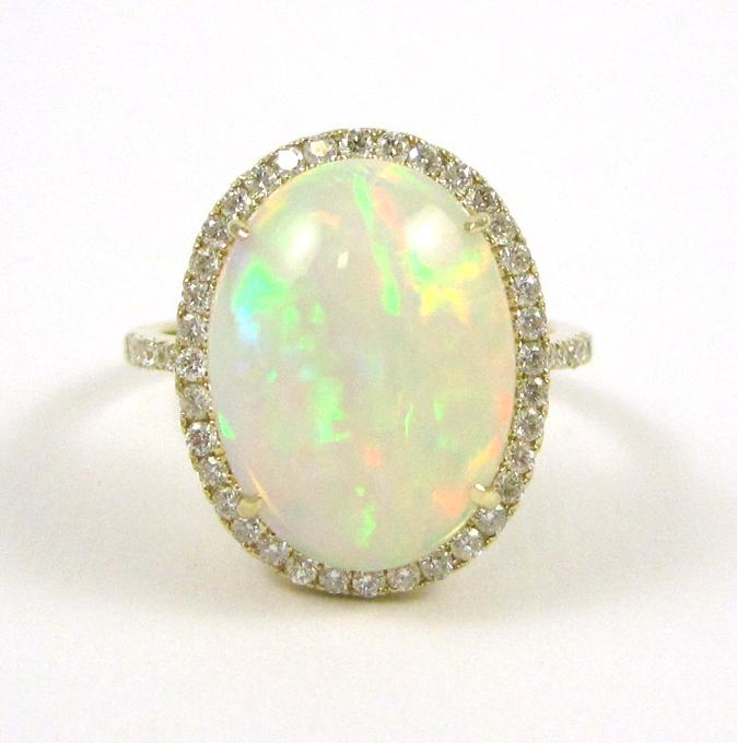 Appraisal: OPAL DIAMOND AND FOURTEEN KARAT GOLD RING with round-cut diamonds