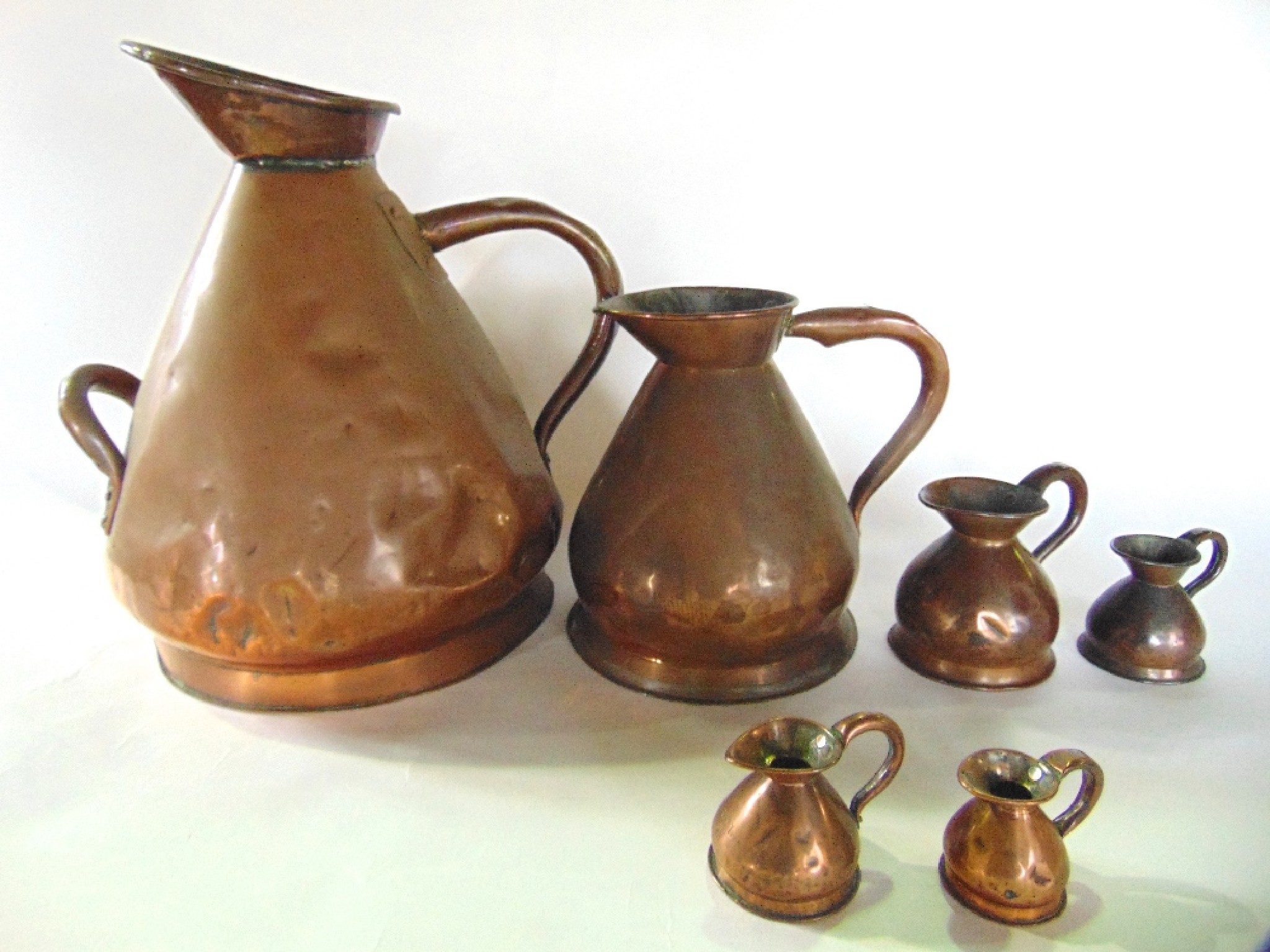 Appraisal: Six associated graduating th century copper measures ranging from four