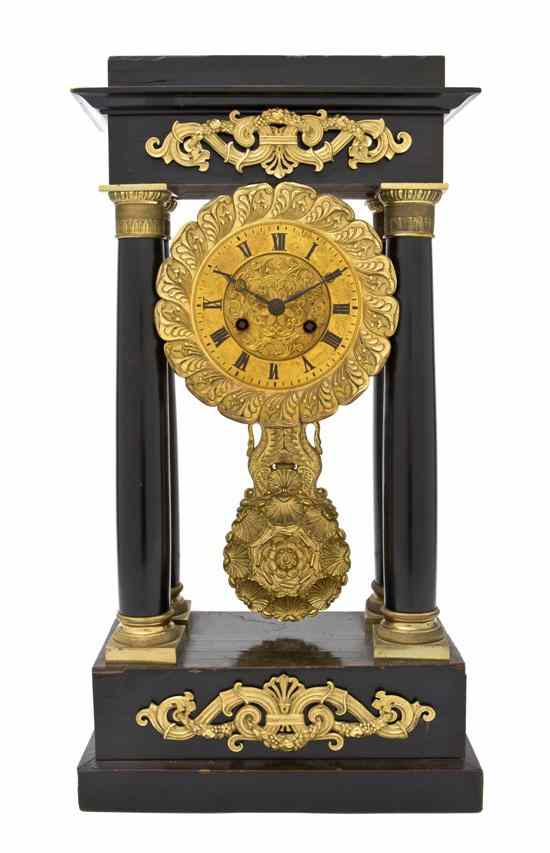 Appraisal: A Neoclassical Ebonized and Gilt Metal Mounted Portico Clock the