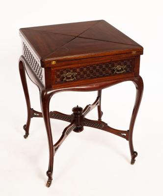 Appraisal: An Edwardian envelope card table on cabriole legs united by