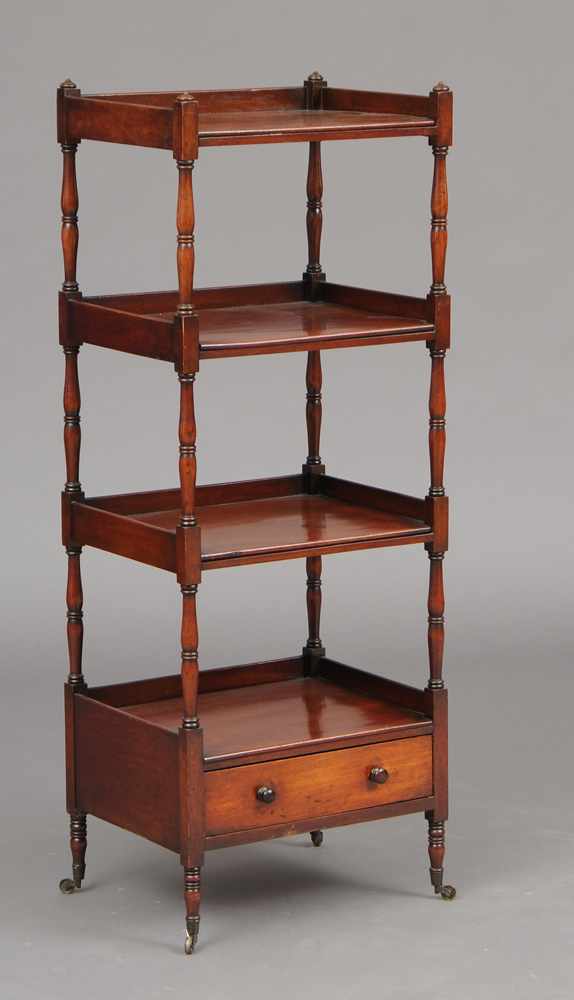 Appraisal: REGENCY MAHOGANY WHATNOT Incorporating four three-quarter galleried shelves on ringed