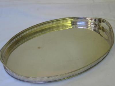 Appraisal: AN EDWARDIAN GALLERIED TEATRAY of oval form pierced fluted sides