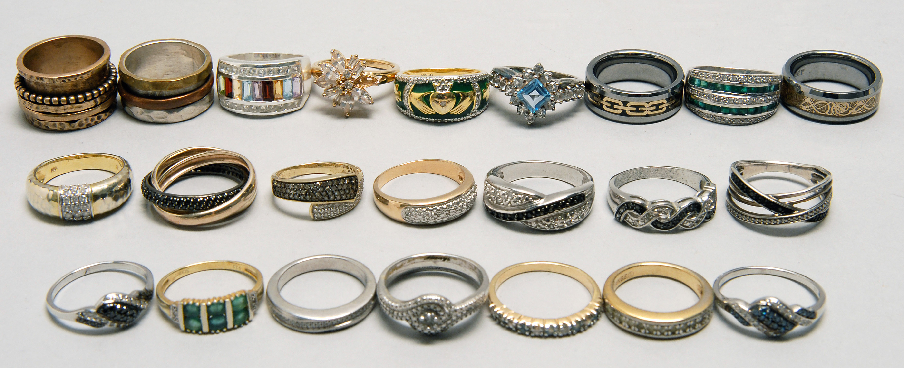 Appraisal: TWENTY-FOUR STERLNG SILVER LADY'S RINGS By various makers including Stauer