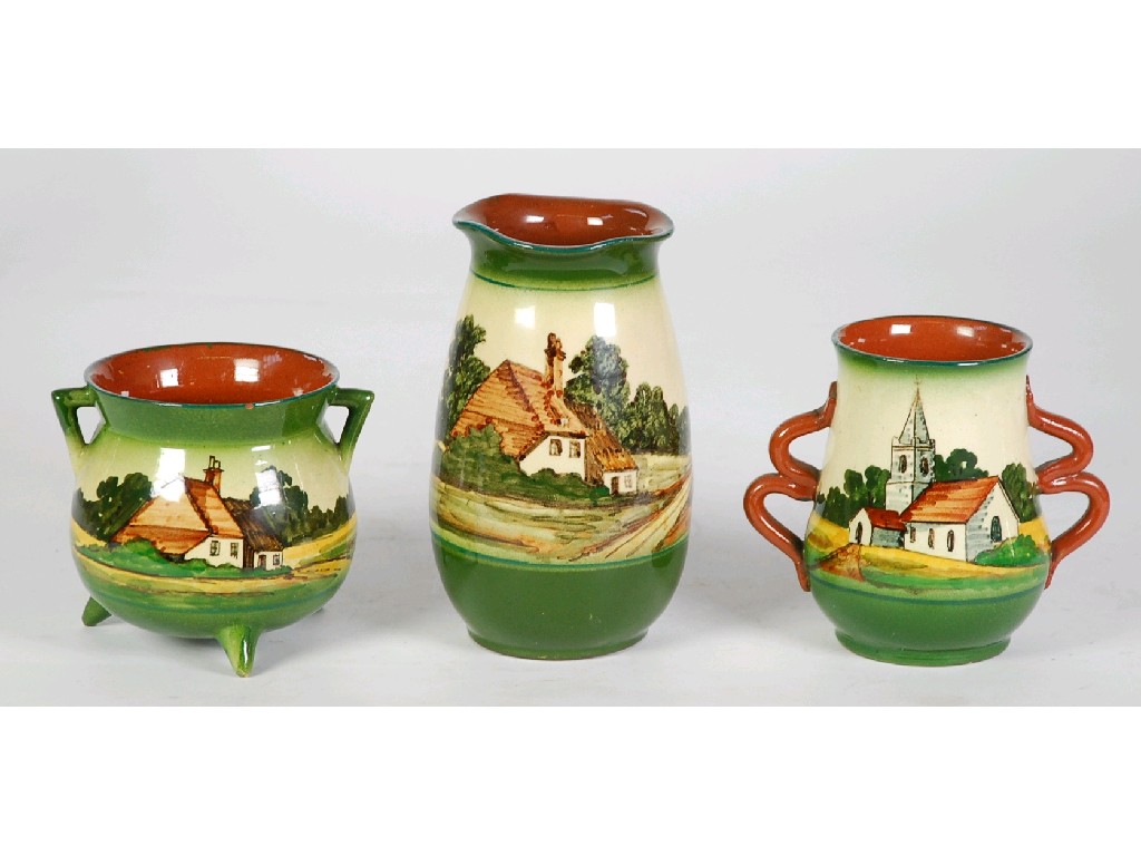 Appraisal: THREE WATCOMBE TORQUAY HAND PAINTED POTTERY VASES decorated with rural