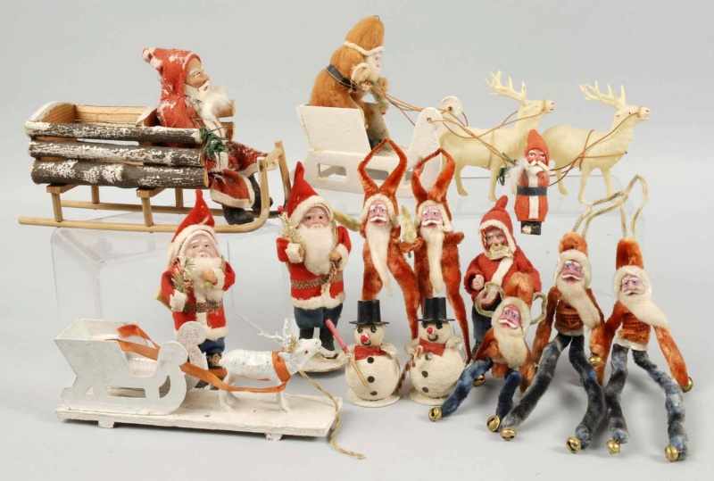 Appraisal: Lot of Santa Christmas Pieces Description Includes three Santas pulling