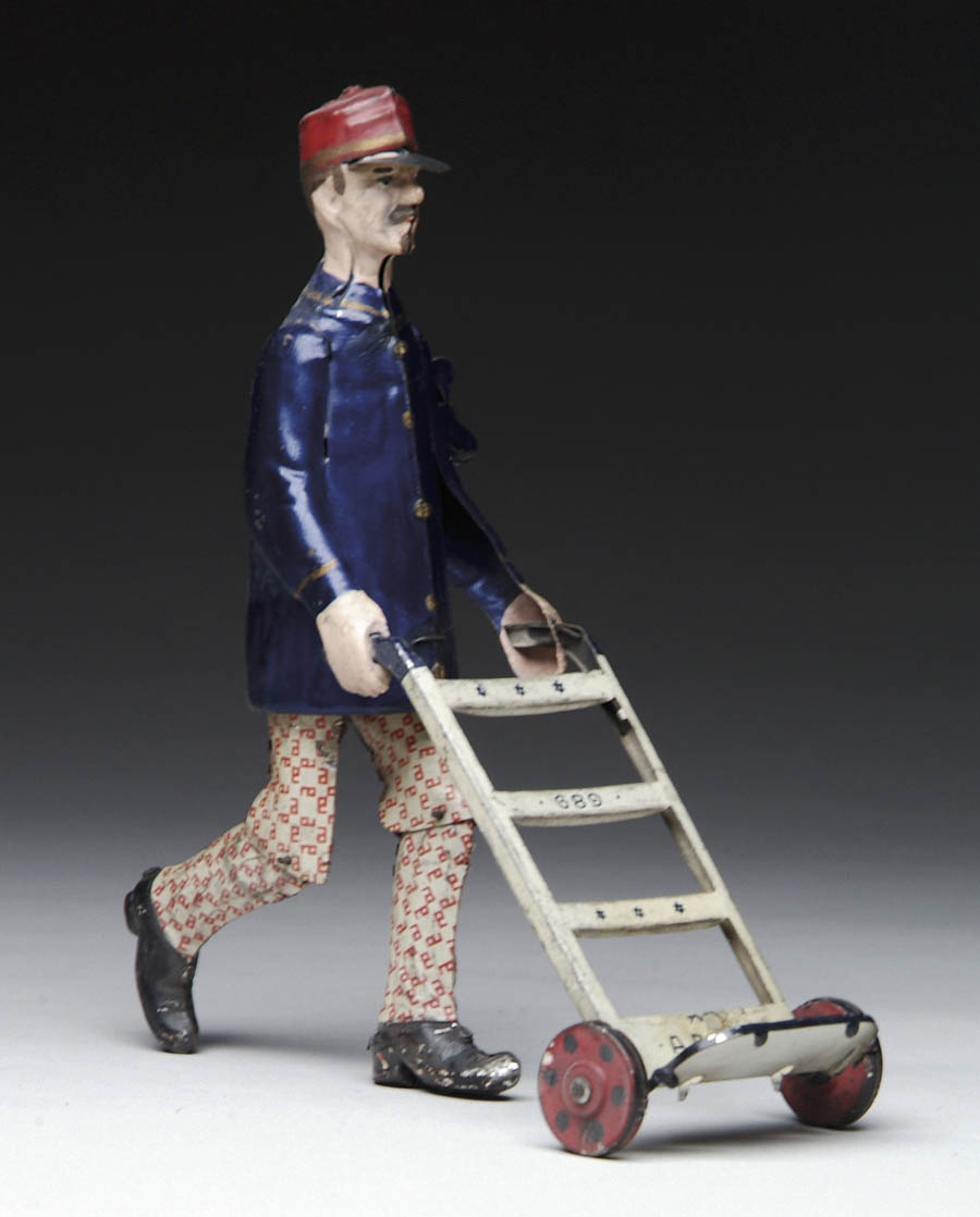 Appraisal: WIND UP TIN TOY MAN WITH CART ADAM Man with