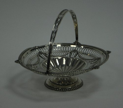 Appraisal: An Edwardian silver cake basket Goldsmiths and Silversmiths Co London