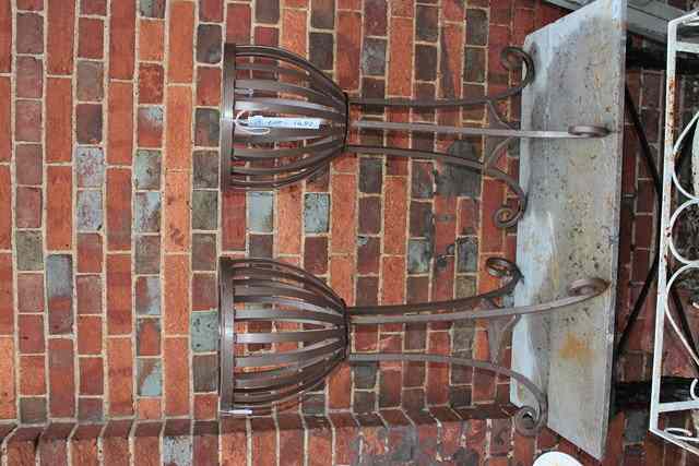 Appraisal: A PAIR OF PAINTED STRAPWORK WROUGHT IRON JARDINIERE STANDS with