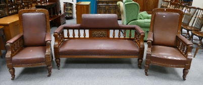 Appraisal: Edwardian carved mahogany framed saloon suit with leather seating including