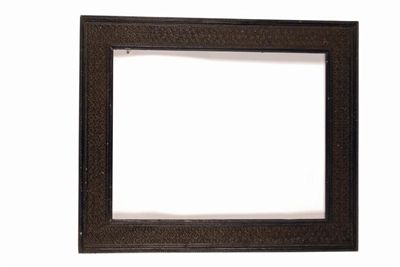 Appraisal: A late th century Indian ebony picture frame carved with