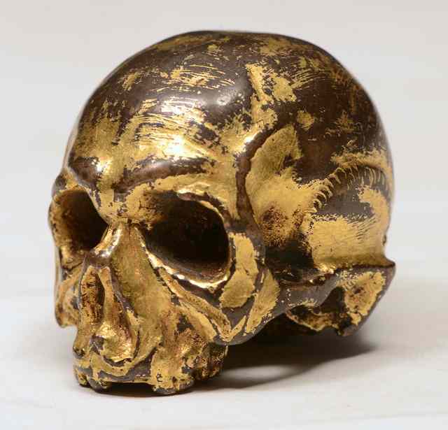 Appraisal: A GERMAN CAST GILT BRONZE of a Maori skull high